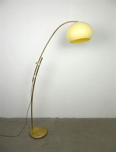 A simple brass base grounds a wide sweeping arc over six feet high, culminating in a. Vintage adjustable brass arc floor lamp, Germany, 1970s - Design Market