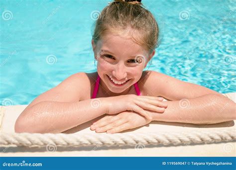 Teenage Girl Leaning On Edge Of Swimming Pool Stock Image Image Of