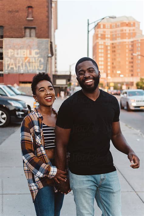 A Young Black Couple Walking Around The City At Sunset By Stocksy Contributor Chelsea