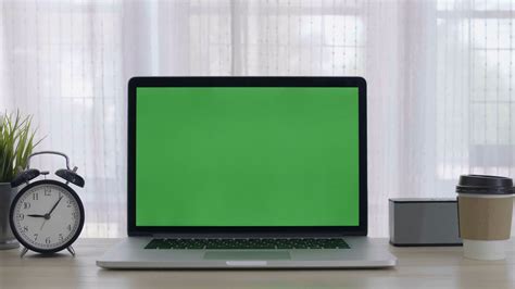 4k Green Screen Of Laptop Computer Set On Working Space In Cozy Office