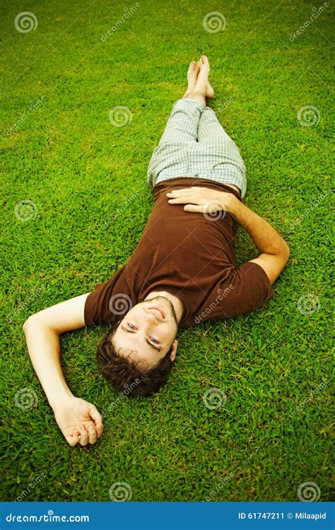 man laying on a grass stock image image of garden lifestyle 61747211