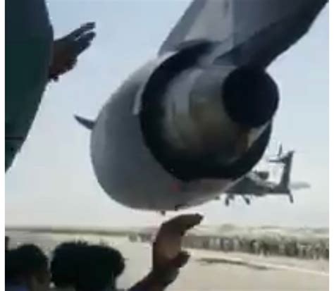 video from person hanging on kabul c 17 military plane emerges claiming he is alive but other