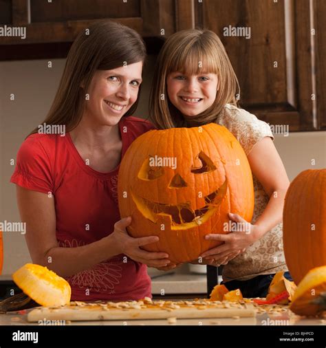 Mother Daughter Carving Pumpkins Hi Res Stock Photography And Images