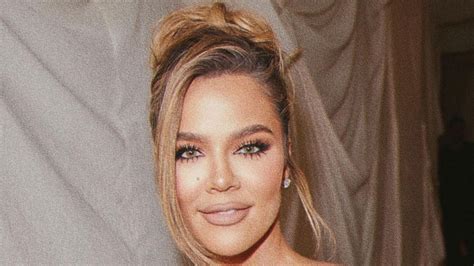 khloe kardashian shows off her real curly hair as she goes pantless in just a blazer for new ad
