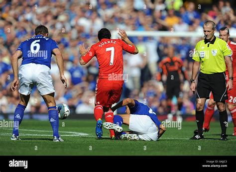 Referee Martin Atkinson Right Watches As Evertons Jack Rodwell