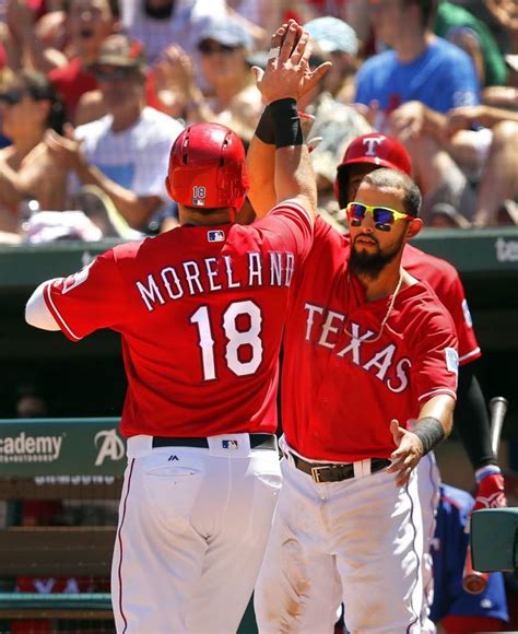 Texas Rangers First Baseman Mitch Moreland 18 Is Congratulated By