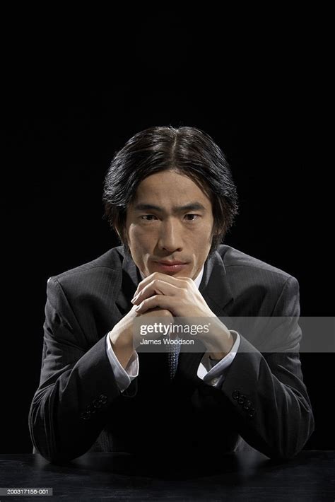 Businessman Resting Chin On Hands Portrait Closeup High Res Stock Photo