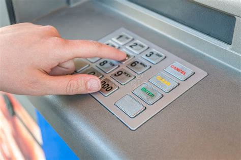 Person Is Using Keypad And Entering Pin Code In Atm Machine Banking