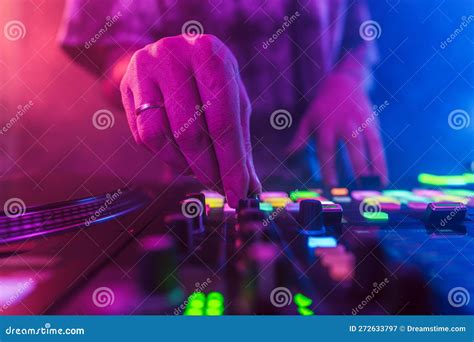 Close Up Of Dj Hands On Dj Console Mixer During Concert In The Club