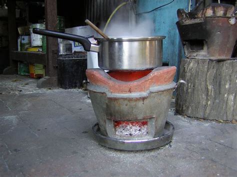 How to light a stove with coal. Bruce Teakle's Pages: Cooking on a Thai Charcoal Stove