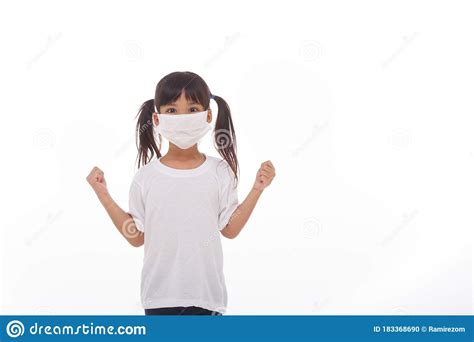 Asia Girl Wearing Mask To Protect Against Coronavirus Girl Show A Fist