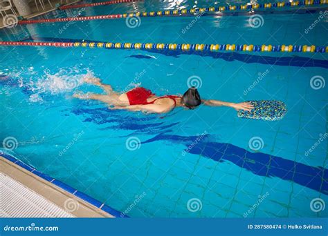 Swimmer Practicing Flutter Kicks In Sports Pool Stock Photo Image Of