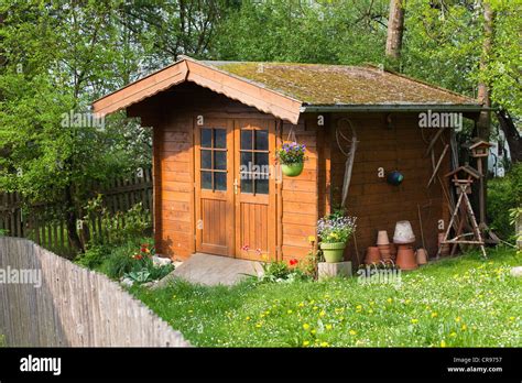 Wooden Garden Shed In Garden Upper Bavaria Germany Europe Stock