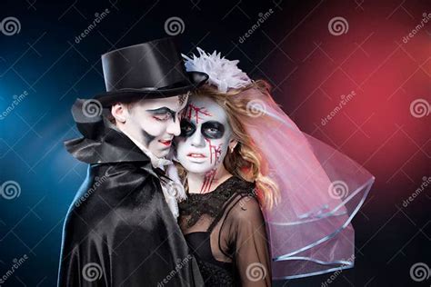 Man And Woman Wearing As Vampire And Witch Halloween Stock Image
