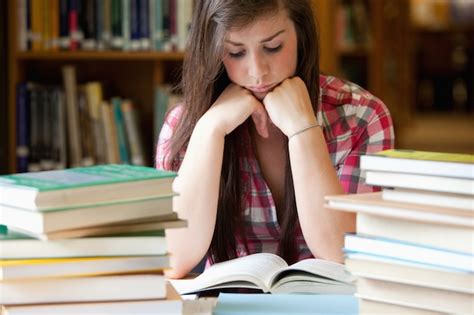 Premium Photo Studious Woman Surrounded By Books