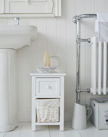 I love to use all kinds of bins for storage. Bar Harbor narrow Small white bathroom cabinet with 2 ...