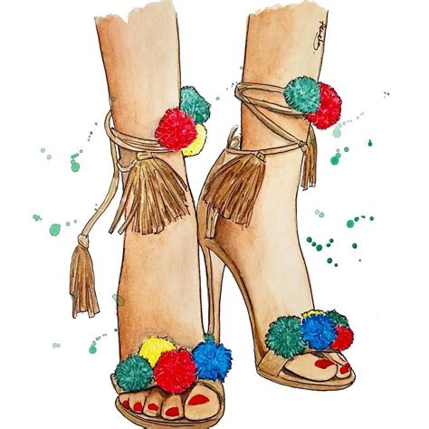 A Pair Of High Heeled Shoes With Pom Poms