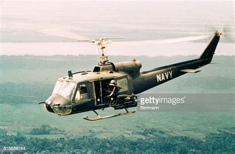 Sighting The Enemy The Door Gunner Aboard A Huey Opens Fire On A