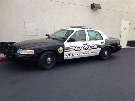 a police car parked in front of a building