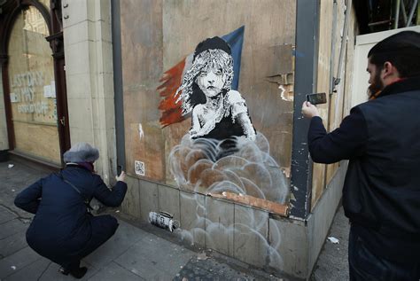 People: Street artist Banksy takes swipe at France on migrant crisis ...
