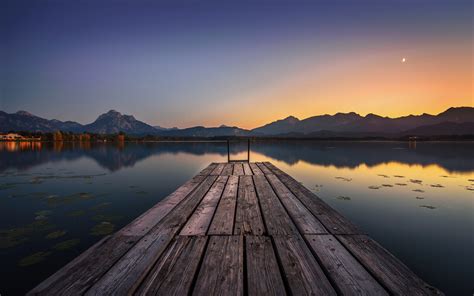 2560x1600 Lake Pier And Mountain Sunset 2560x1600 Resolution Wallpaper