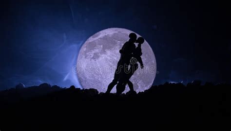Silhouette Of Couple Kissing Under Full Moon Guy Kiss Girl Hand On