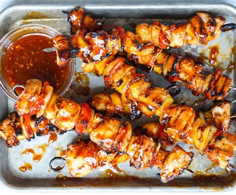 These pineapple chicken kabobs with bacon are guaranteed to be a hit. BBQ Chicken Bacon Pineapple Kabobs #recipes #grilled