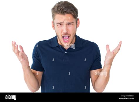 Handsome Young Man Shrugging Shoulders Stock Photo Alamy