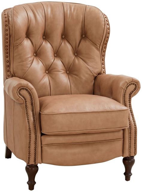 A Tan Leather Recliner Chair With Nail Polishing On The Armrests And Arms