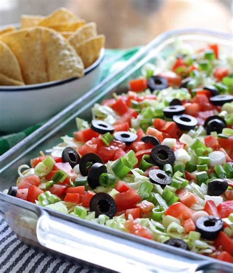 Easy Layered Taco Dip Recipe With Ground Beef The Thirsty Feast By