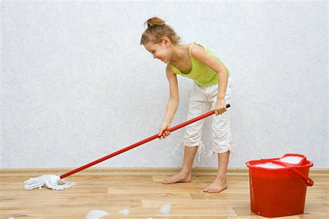 Girl Sweeping The Floor With The Broom Stock Photos Pictures And Royalty