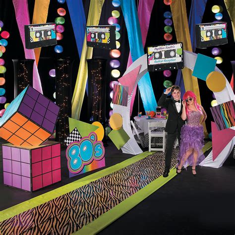 Two People Are Standing In Front Of Some Colorful Decorations On The