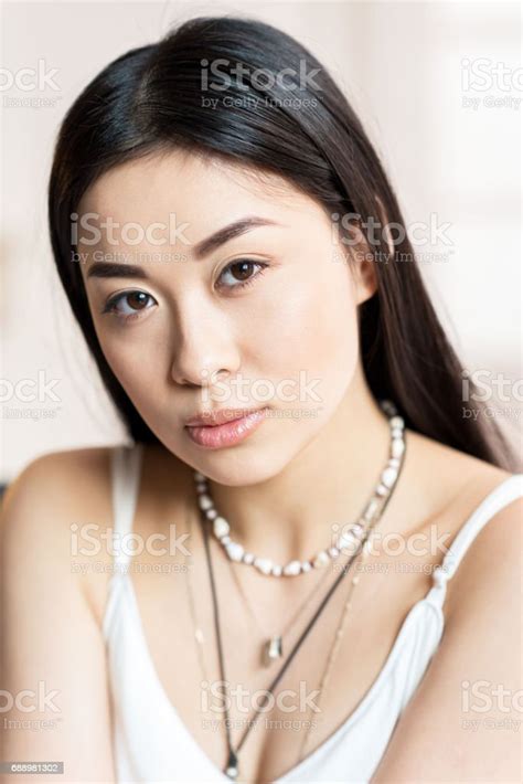 Close Up Portrait Of Beautiful Asian Woman In White Dress Stock Photo