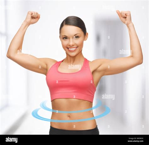 Picture Of Beautiful Sporty Woman Flexing Her Biceps Stock Photo Alamy