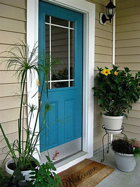 The easiest way to order is front door with windows above and trim. beige house exterior with teal front door | Benjamin Moore ...