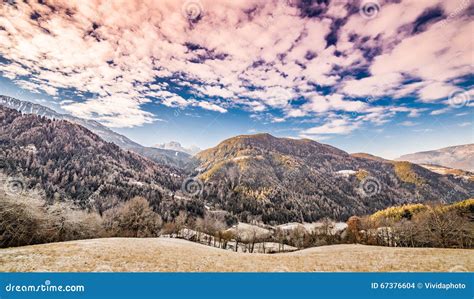 Reddish Sky Over Snowy Mountains Stock Photo Image Of Lonely Green