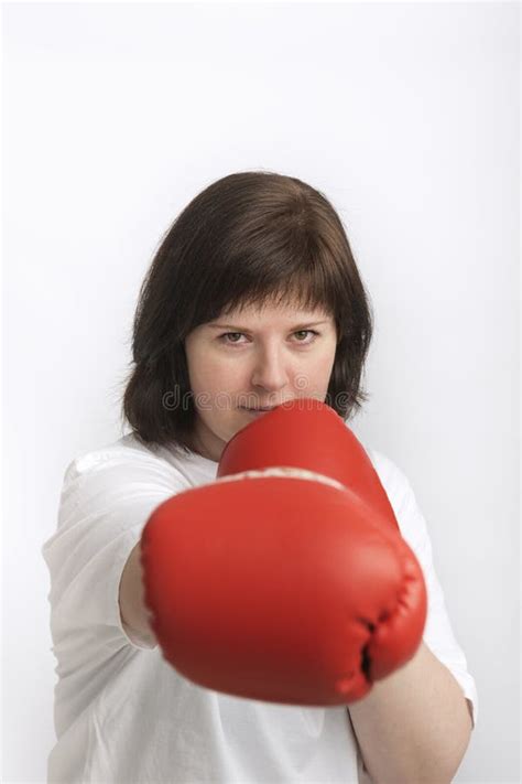 Portrait Of Confident Young Woman In Boxing Gloves Woman Fights For