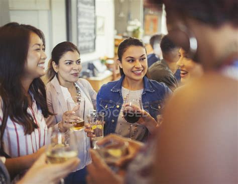 Women Friends Talking And Drinking Beer And Wine At Bar — Girls Night