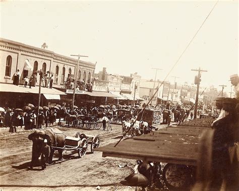 A Circus Parade Going Through Downtown Iowa Falls Iowa Circa 1890