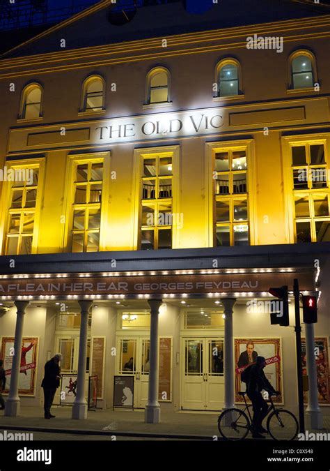 Front View Of The Old Vic Theatre Floodlit At Night In London Stock