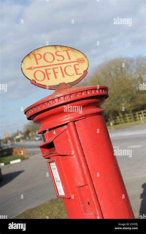 Traditional English Red Pillar Box With A Rare Post Office Sign On Top