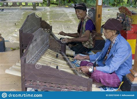 Two Old Men Are Playing A Balinese Musical Instrument Editorial Image