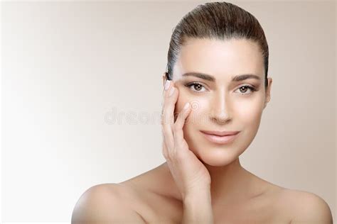 Beautiful Brunette Woman With Clean Fresh Skin Touch Own Face Looking