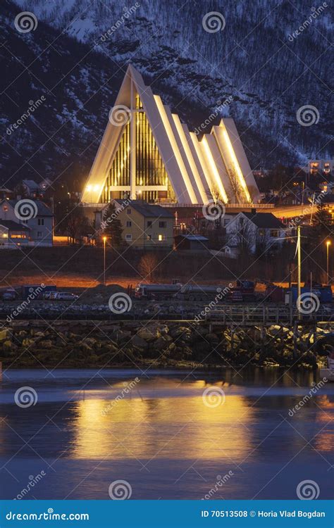 The Arctic Cathedral In Tromso Reflected In The Fjord Stock Photo