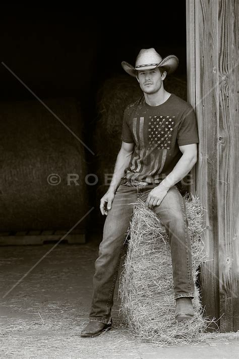 Hot Cowboy Sitting On A Bale Of Hay In A Barn Rob Lang Images Licensing And Commissions