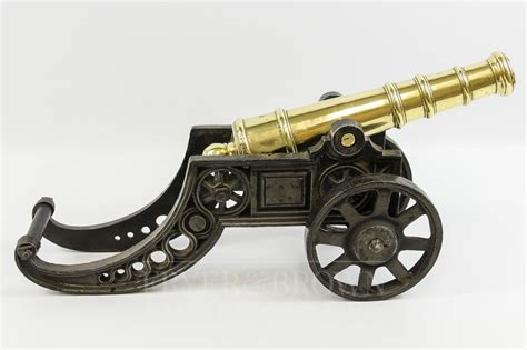 A Brass And Cast Iron Desk Model Of A Cannon Cannon Iron Desk Brass
