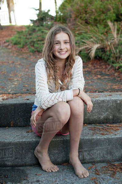Barefoot Girl Sitting On Park Steps Stock Photo Dissolve