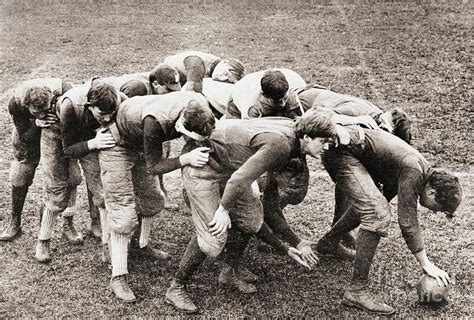 Football Players In Flying Wedge By Bettmann