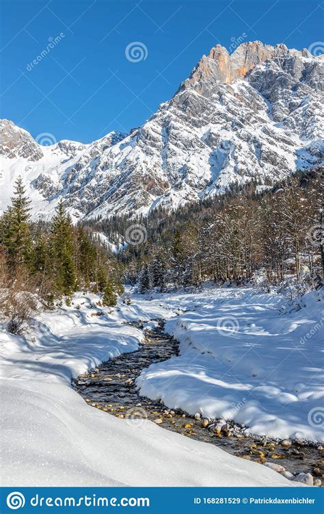 Sunny Winter Landscape In The Alps Mountain Range River