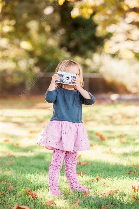 Toddler Girl Using Retro Camera In Park Stock Image F0155300